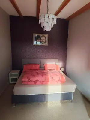 Ein Bett oder Betten in einem Zimmer der Unterkunft Ferienhaus mit 2 Schlafzimmern