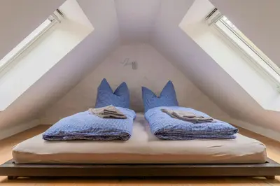 Ein Bett oder Betten in einem Zimmer der Unterkunft Historic Forester's House Tornow In Forest Setting