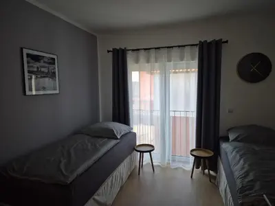 Ein Bett oder Betten in einem Zimmer der Unterkunft PuraVida Apartments Berlin Heiligensee