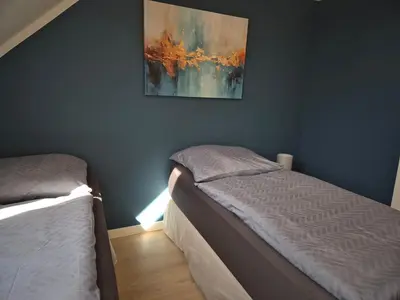 Ein Bett oder Betten in einem Zimmer der Unterkunft PuraVida Apartments Berlin Heiligensee