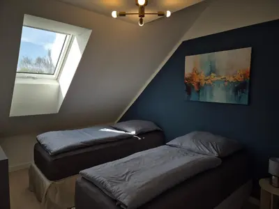Ein Bett oder Betten in einem Zimmer der Unterkunft PuraVida Apartments Berlin Heiligensee