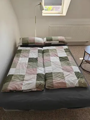 Ein Bett oder Betten in einem Zimmer der Unterkunft Ferienwohnung in Kleinstadt nähe Spreewald