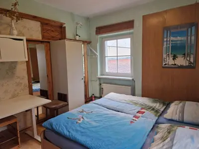 Ein Bett oder Betten in einem Zimmer der Unterkunft Wohnung im Haus am See von Berlin