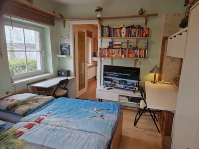 Ein Bett oder Betten in einem Zimmer der Unterkunft Wohnung im Haus am See von Berlin