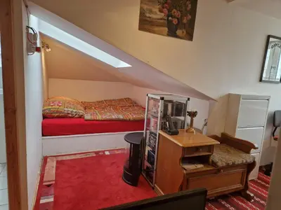 Ein Bett oder Betten in einem Zimmer der Unterkunft Dachgeschosswohnung im Haus am See von Berlin