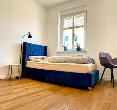 Ein Bett oder Betten in einem Zimmer der Unterkunft Studio Versteck am Hug