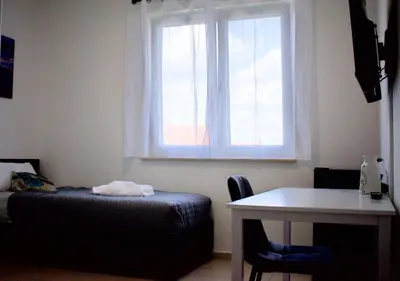 Ein Bett oder Betten in einem Zimmer der Unterkunft Appartementhaus