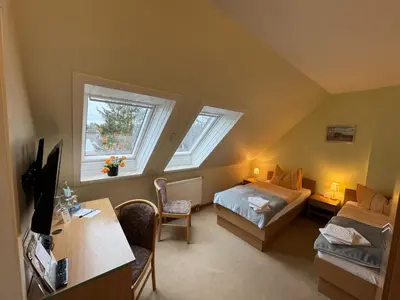 Ein Bett oder Betten in einem Zimmer der Unterkunft Haus Katharinensee