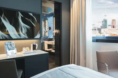 Ein Bett oder Betten in einem Zimmer der Unterkunft Riu Plaza Berlin