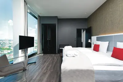 Ein Bett oder Betten in einem Zimmer der Unterkunft Riu Plaza Berlin