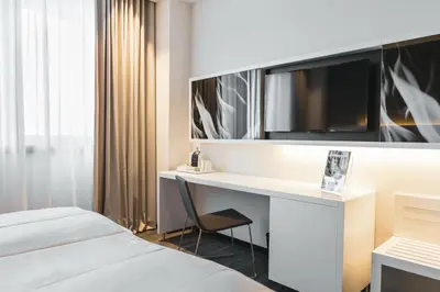 Ein Bett oder Betten in einem Zimmer der Unterkunft Riu Plaza Berlin