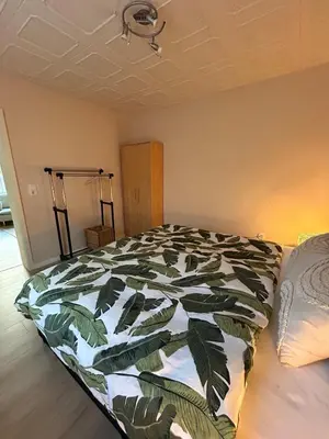 Ein Bett oder Betten in einem Zimmer der Unterkunft FeWo am Mainplatz