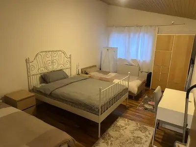 Ein Bett oder Betten in einem Zimmer der Unterkunft Ferienhaus nahe Berlin Bungalow mit Kamin