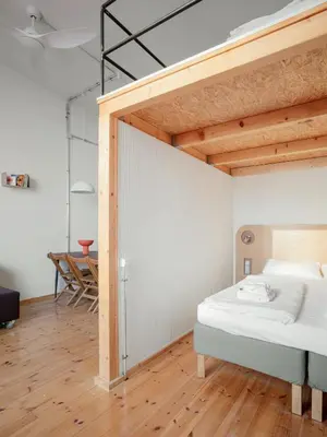 Ein Bett oder Betten in einem Zimmer der Unterkunft Flattering Suites