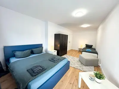 Ein Bett oder Betten in einem Zimmer der Unterkunft Apartment for large groups south of Berlin