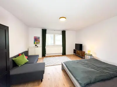 Ein Bett oder Betten in einem Zimmer der Unterkunft Apartment for large groups south of Berlin