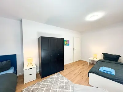 Ein Bett oder Betten in einem Zimmer der Unterkunft Apartment for large groups south of Berlin