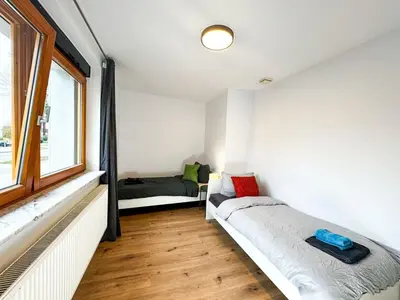 Ein Bett oder Betten in einem Zimmer der Unterkunft Apartment for large groups south of Berlin