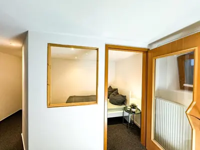 Ein Bett oder Betten in einem Zimmer der Unterkunft Apartment for large groups south of Berlin