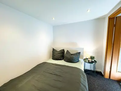 Ein Bett oder Betten in einem Zimmer der Unterkunft Apartment for large groups south of Berlin