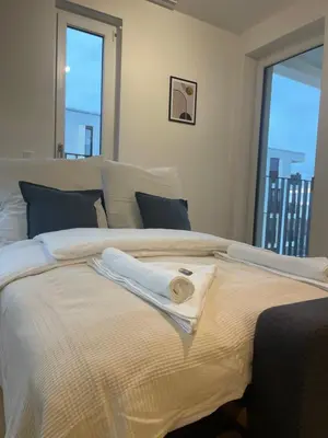 Ein Bett oder Betten in einem Zimmer der Unterkunft Gemütliches Apartment am BER Flughafen