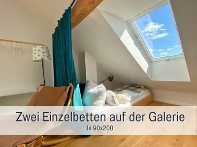 Ein Bett oder Betten in einem Zimmer der Unterkunft Landloft Linum - Ausgebaute Scheune mit Aussicht, Naturpool, Kamin, Sauna, Luxusausbau, handverlesene MidCentury Möbel & Kunst