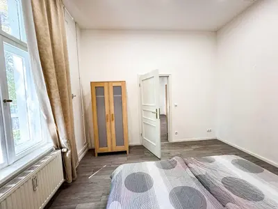 Ein Bett oder Betten in einem Zimmer der Unterkunft Ferienwohnungen Grabbeallee #1