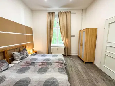Ein Bett oder Betten in einem Zimmer der Unterkunft Ferienwohnungen Grabbeallee #1