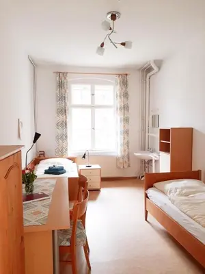 Ein Bett oder Betten in einem Zimmer der Unterkunft Die Malche Gäste und Tagungshaus 27