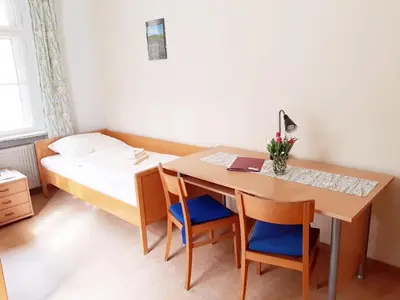 Ein Bett oder Betten in einem Zimmer der Unterkunft Die Malche Gäste und Tagungshaus 26