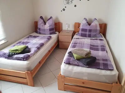 Ein Bett oder Betten in einem Zimmer der Unterkunft FeWo Schütz