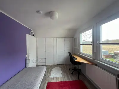 Ein Bett oder Betten in einem Zimmer der Unterkunft Ferienwohnung in Neuenhagen
