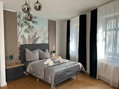 Ein Bett oder Betten in einem Zimmer der Unterkunft Lindenallee Apartments
