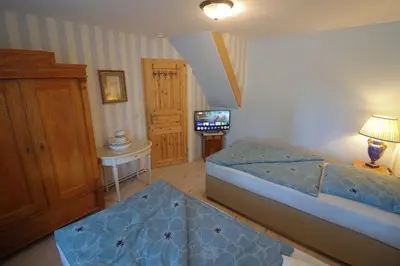 Ein Bett oder Betten in einem Zimmer der Unterkunft Berlinurlaub im Grünen, 6 Betten, Pool, Sauna, Spielplatz, Grill, Tischtennis