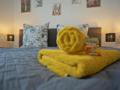 Ein Bett oder Betten in einem Zimmer der Unterkunft HOGULU - 3 - RAUM - App 25 mit Balkon