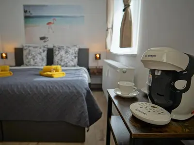 Ein Bett oder Betten in einem Zimmer der Unterkunft HOGULU - 3 - RAUM - App 25 mit Balkon