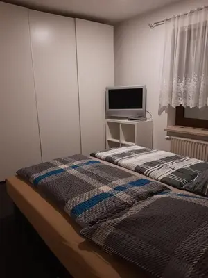 Ein Bett oder Betten in einem Zimmer der Unterkunft Ferienwohnung für Monteure