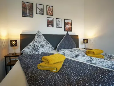 Ein Bett oder Betten in einem Zimmer der Unterkunft Hogulu - 2 - RAUM - App 4
