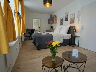 Ein Bett oder Betten in einem Zimmer der Unterkunft Hogulu - im Herzen der Altstadt Appartement 3