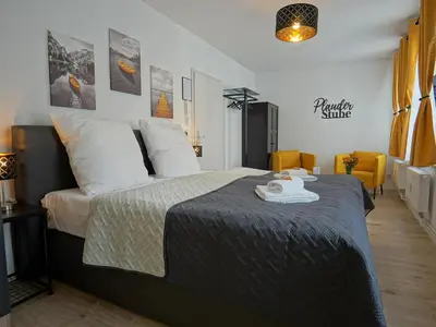 Ein Bett oder Betten in einem Zimmer der Unterkunft Hogulu - im Herzen der Altstadt Appartement 3