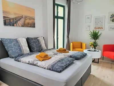 Ein Bett oder Betten in einem Zimmer der Unterkunft Hogulu - ruhig gelegenes Appartement 22 in der Altstadt