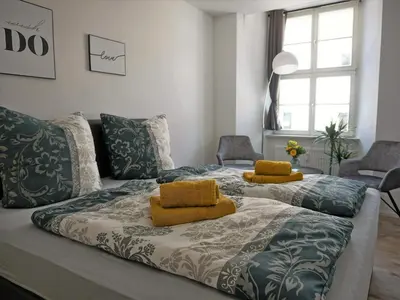 Ein Bett oder Betten in einem Zimmer der Unterkunft Hogulu - unweit der Jahrtausendbrücke Appartement 8