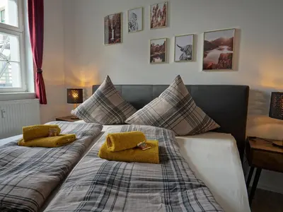 Ein Bett oder Betten in einem Zimmer der Unterkunft Hogulu - STILVOLL UND ZENTRAL - 3-RAUM Appartement 1