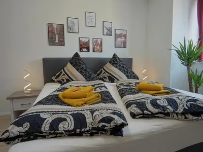 Ein Bett oder Betten in einem Zimmer der Unterkunft Hogulu - urgemütliches Appartement 19 in der Altstadt