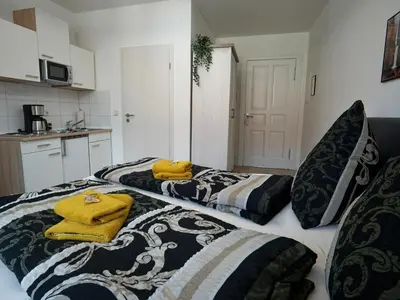 Ein Bett oder Betten in einem Zimmer der Unterkunft Hogulu - urgemütliches Appartement 19 in der Altstadt