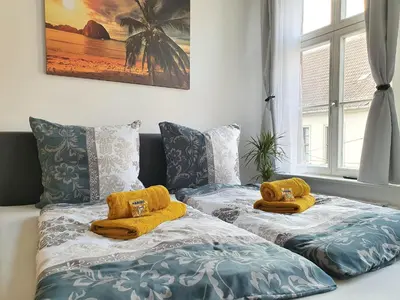Ein Bett oder Betten in einem Zimmer der Unterkunft Hogulu - außergewöhnliches Appartement 9 in der Altstadt