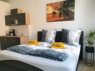 Ein Bett oder Betten in einem Zimmer der Unterkunft Hogulu - außergewöhnliches Appartement 9 in der Altstadt