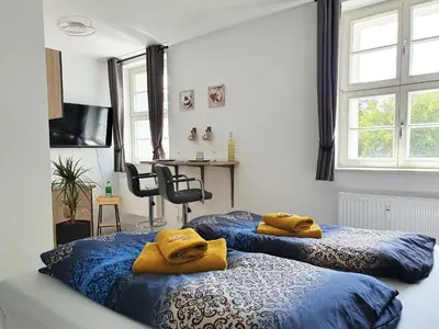 Ein Bett oder Betten in einem Zimmer der Unterkunft Hogulu - schickes Appartement 5 in der Altstadt