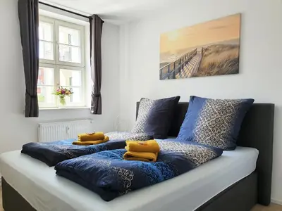 Ein Bett oder Betten in einem Zimmer der Unterkunft Hogulu - schickes Appartement 5 in der Altstadt