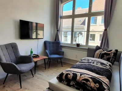 Ein Sitzbereich in der Unterkunft Hogulu - klein und fein in der Altstadt, Appartement 10